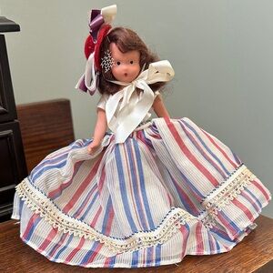 Striped Doll with Red and Blue Dress